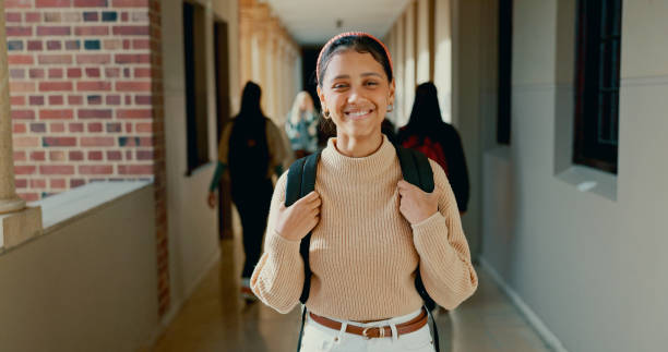 istock Smile, hallway and portrait of student at school with backpack for learning, studying or knowledge. Happy, teenager and girl in corridor of academy for education class with scholarship. 2184510732
