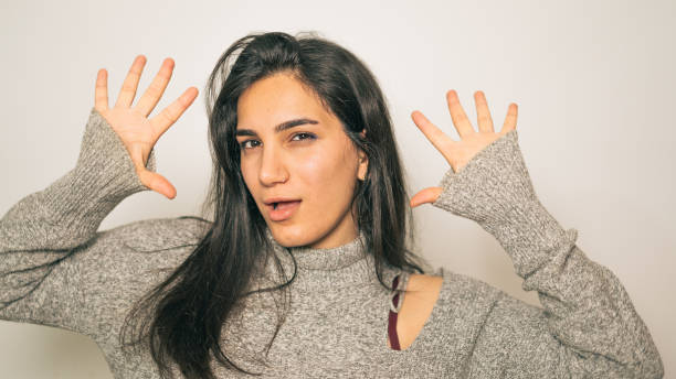 istock Expressive Young Woman Posing Playfully 2184510779