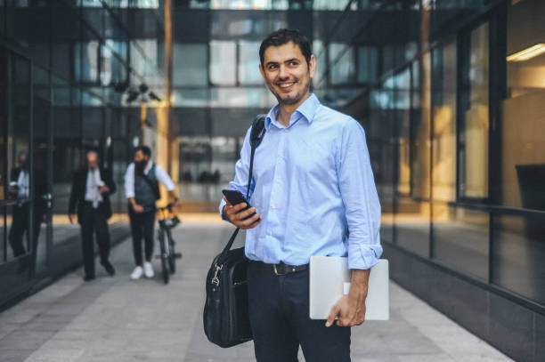 istock Business Professional in Urban Setting with Smartphone and Tablet 2184512905