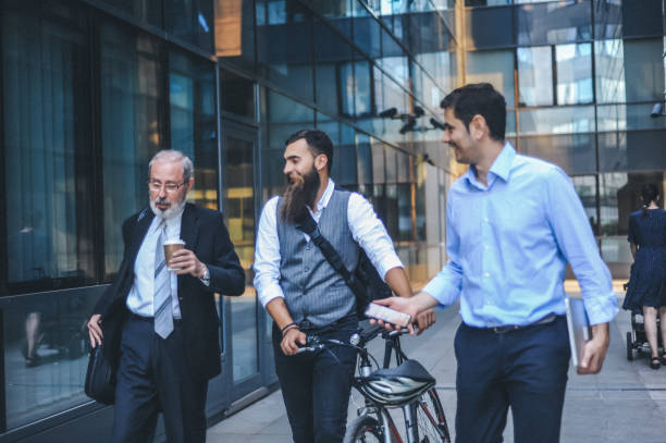istock Businessmen Walking and Talking Outdoors 2184512907