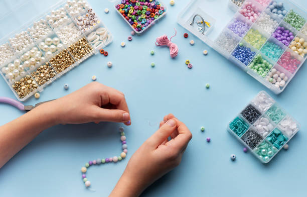 istock Creating colorful beaded jewelry with vibrant materials on a crafting table 2184513519