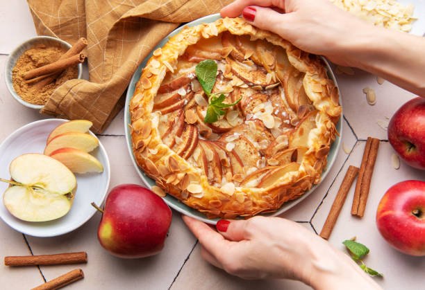 istock Apple galette preparation with fresh ingredients and spices on a kitchen countertop 2184514145