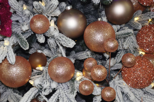 istock Golden shiny balls on the Christmas tree. 2184518597