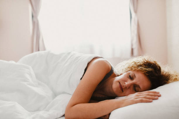 istock Woman sleep in bed 2184520117