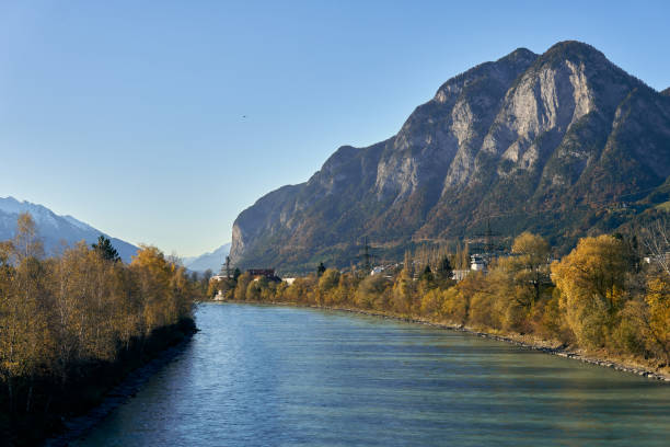 istock Serene river flows past autumn trees and majestic mountains in a peaceful landscape 2184521944