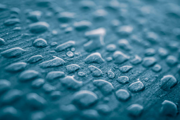 raindrops on the wooden surface, blue background, rainy days