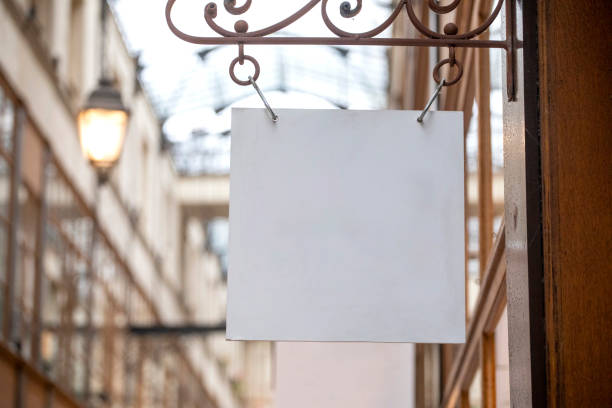 istock Sign hanging outside a shop in an arcade with copy space 2184527995