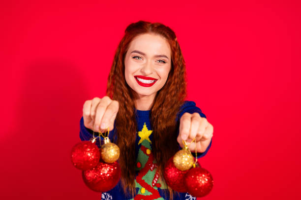 istock Photo of shiny attractive lady dressed ornament pullover giving x-mas decorations empty space isolated red color background 2184528204