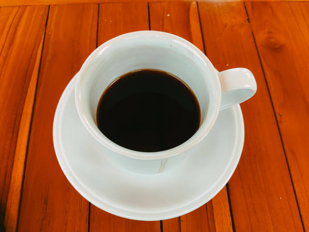 istock A used coffee cup with a striking coffee stain on a wooden table 2184528355
