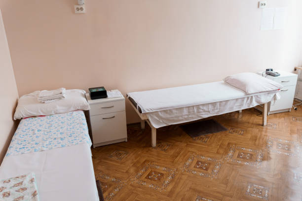 istock Minimalist Treatment Room with Two Beds and Basic Amenities 2184530029