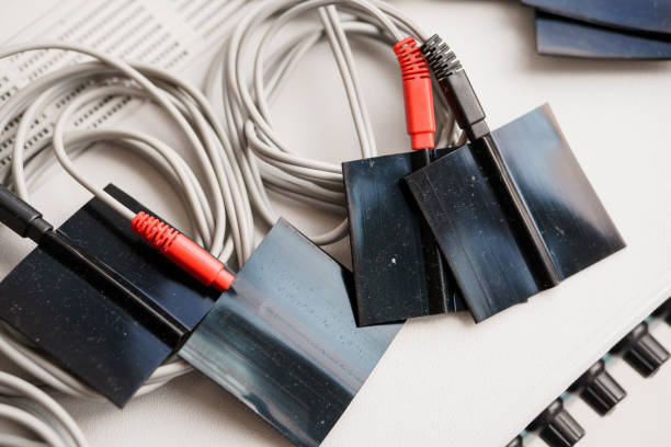 istock Close-Up of Audio Patch Cables with Color-Coded Connectors on a Mixing Board 2184531717