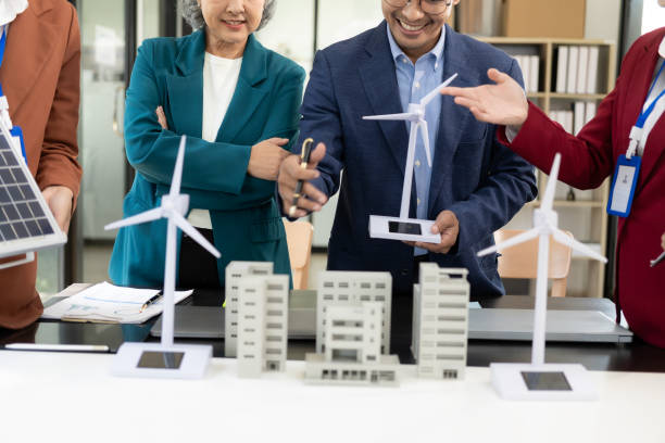 istock Team of professional designers discuss new project work in conference room, propose renewable energy sources and design sustainable architecture with clean energy in modern office. 2184533343