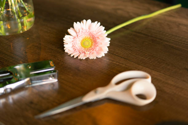 Flower bouquet making equipment lies on the table