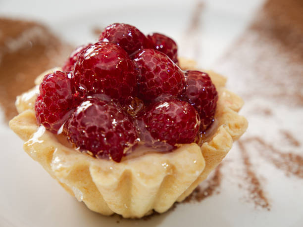 istock fresh tasty dessert, tart with raspberry, close up 2184539087