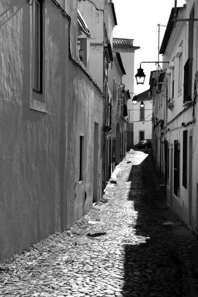 Evora, Portugal- October 10, 2022:Typical Portuguese facades and cobblestone streets in Evora town, Portugal