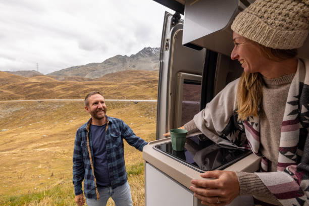istock Couple Enjoying Coffee Break on Mountain Road Trip 2184544114