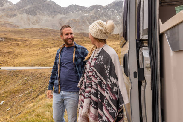 istock Smiling Couple Enjoying a Roadside Mountain Adventure 2184544238