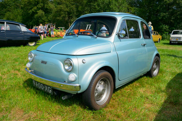 Fiat 500R classic compact Italian family car parked in a field.