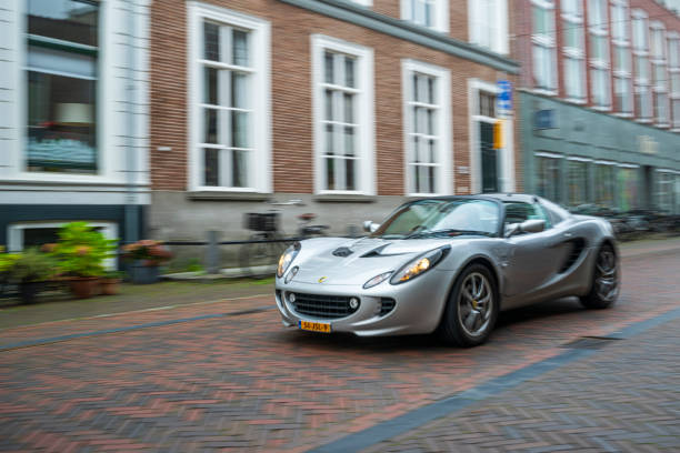 Lotus Elise compact sports car driving on the street in Zwolle during a charity event.