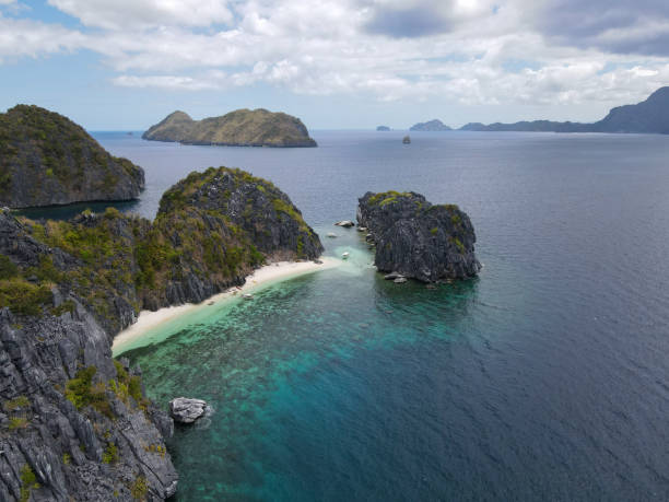 istock Remote Island Beach with Limestone Cliffs and Azure Waters 2184548248