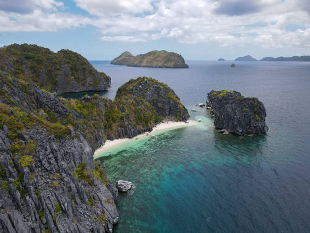 istock Remote Island Beach with Limestone Cliffs and Azure Waters 2184548253