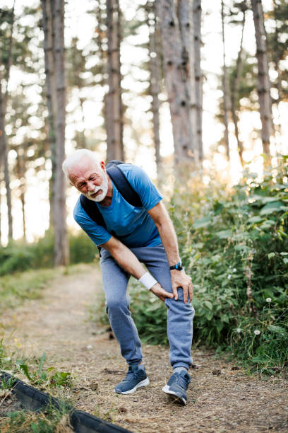 istock Senior man runner with knee pain in the park 2184552178