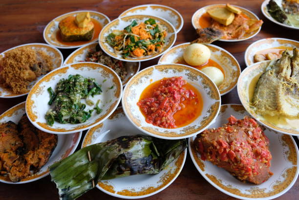 istock Assorted traditional Padang food is served in a plate on a table. 2184552798