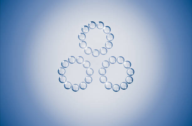 This image showcases an abstract geometric pattern formed by transparent blue glass bubbles on a subtle gradient background, representing cyclic peptides. Great for science and biochemical themes.