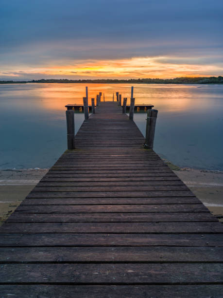istock Lagoon with wooden pier, at first light of dawn 2184562736