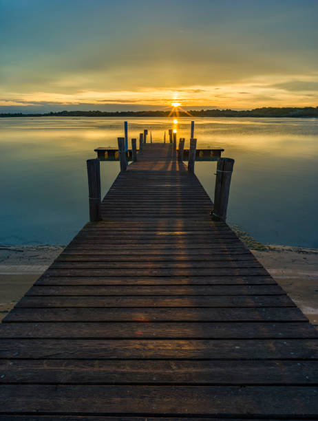 istock Lagoon with wooden pier, at first light of dawn 2184563628