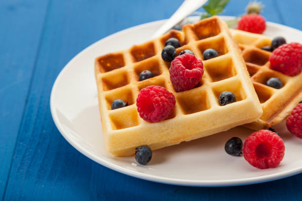 istock Belgian waffles with berry fruit closeup 2184565173