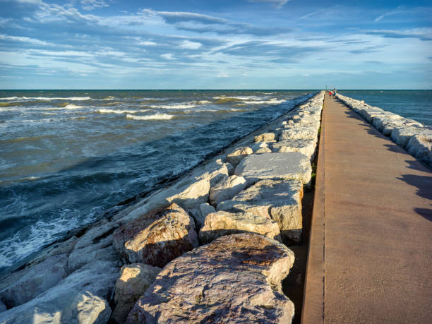 istock Rock and concrete pier on the sea 2184566324