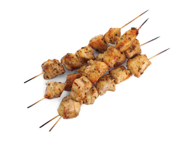 istock Delicious fresh shish kebabs isolated on white, top view 2184567398