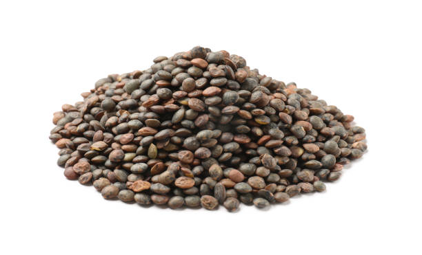istock Pile of raw lentils isolated on white 2184567545