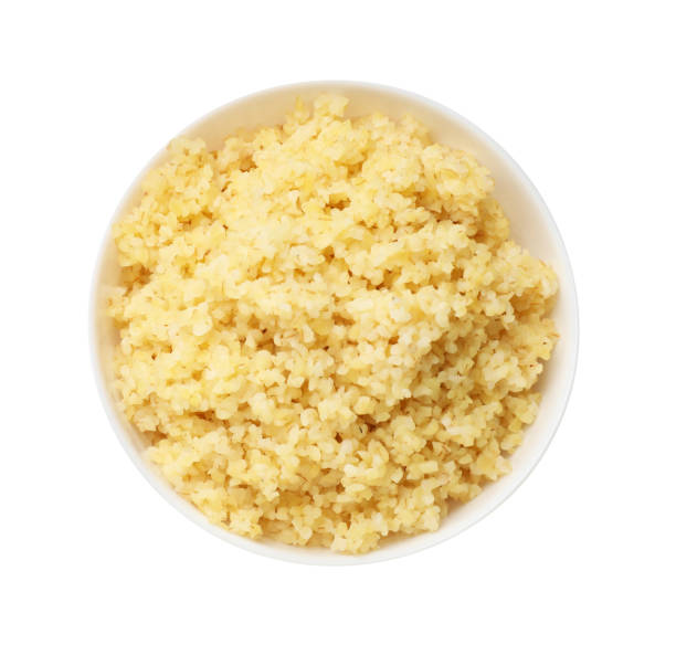 istock Delicious bulgur in bowl isolated on white, top view 2184567958