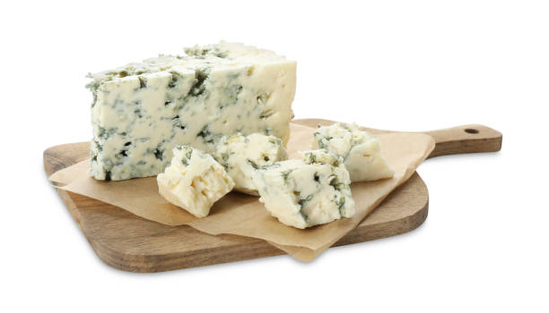 Wooden cutting board with blue cheese isolated on white