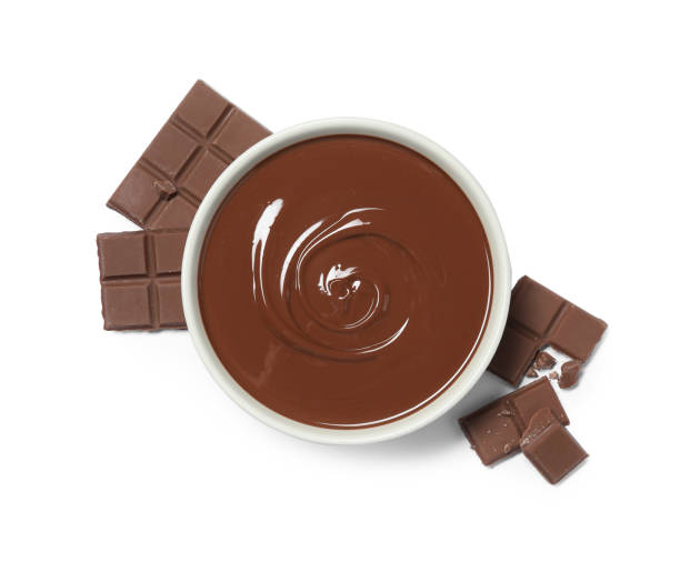 istock Milk chocolate paste in bowl and pieces isolated on white, top view 2184569494