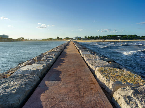 istock Rock and concrete pier on the sea 2184570638