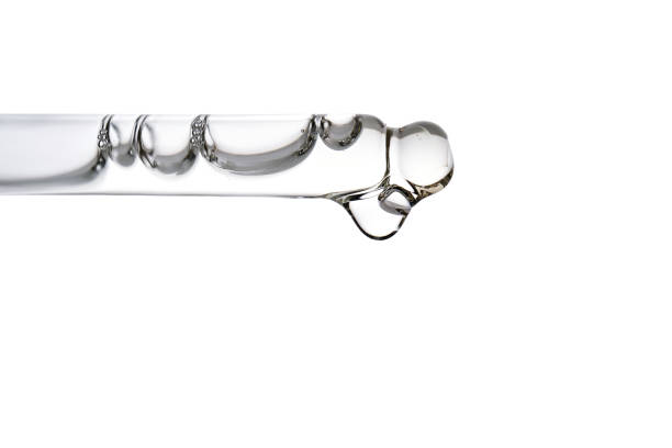 istock Dropper pipette with delicious serum with bubbles close-up. 2184573914