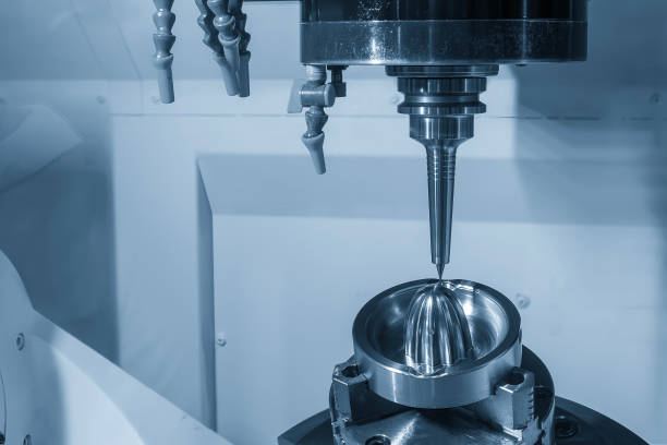 istock The 5-axis CNC milling machine  cutting the sample part with solid ball nose end mill tool. 2184576438
