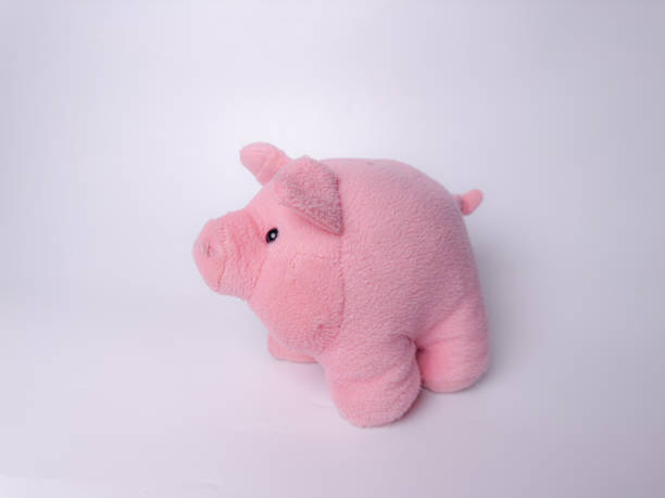 istock A soft and charming pink plush pig toy with a friendly expression 2184578308