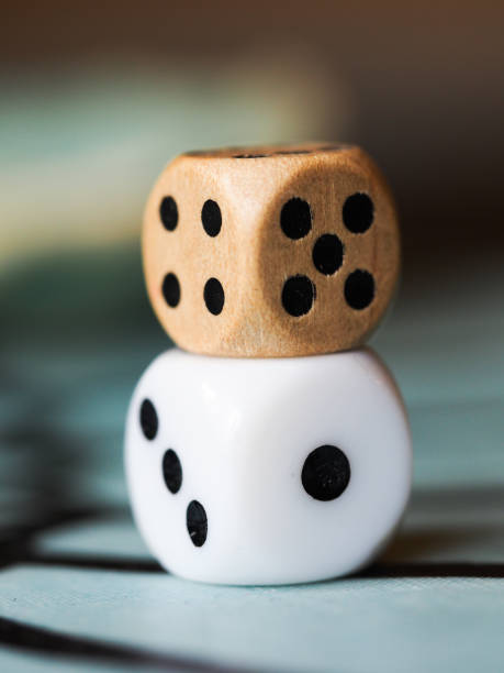 istock One plastic and one wooden die 2184581293