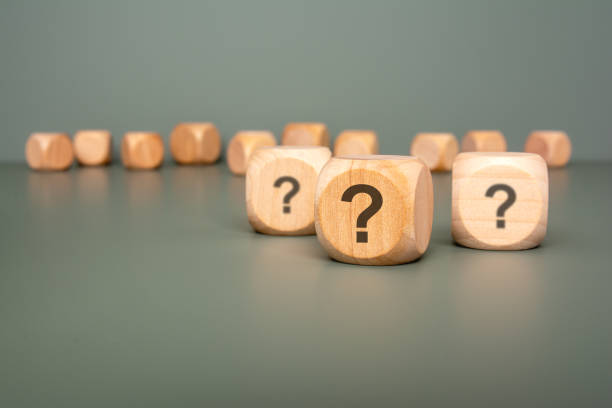 istock Wooden Dice featuring Question Marks displayed on a Vibrant Green Background for Effect 2184581750