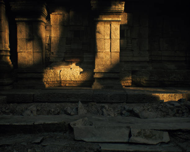 Ruins of an ancient temple lit by dappled sunlight in forest. 3D render.