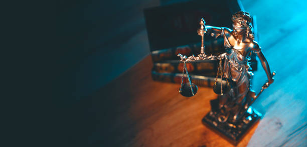 istock Lady Justice figurine on table. Law and justice 2184582581