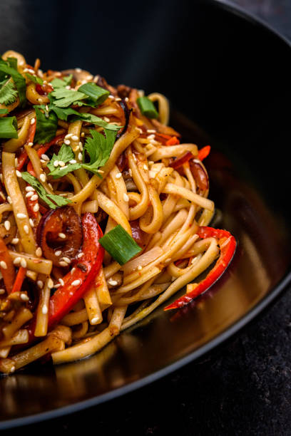 istock Asian Stir-Fried Noodles with Vegetables and Sesame Seeds 2184583158