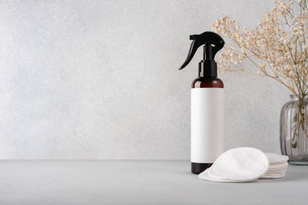 istock Cosmetic spray bottle for packaging product with cotton pads on neutral background 2184583739