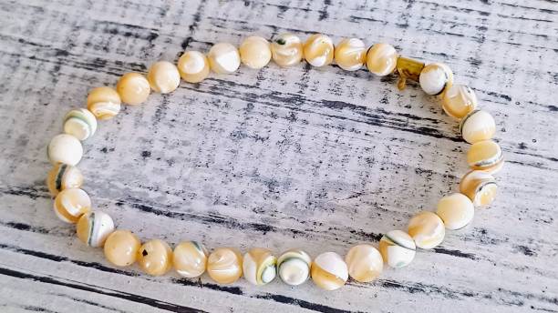 istock cream colored beaded women's bracelet 2184584004