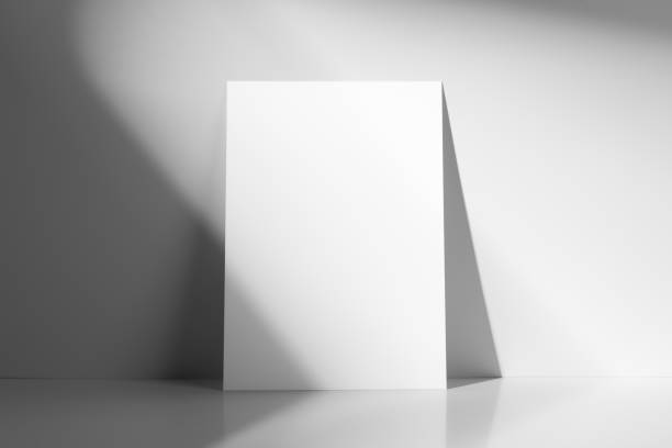 istock Minimalist white or grey background with a blank white poster with the shadows 2184584078