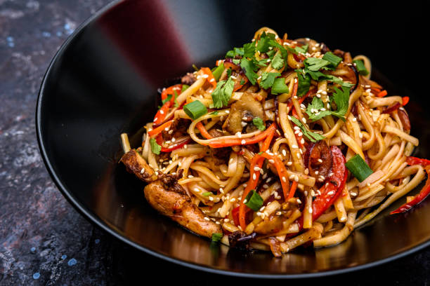 istock Asian Stir-Fried Noodles with Vegetables and Sesame Seeds 2184585953